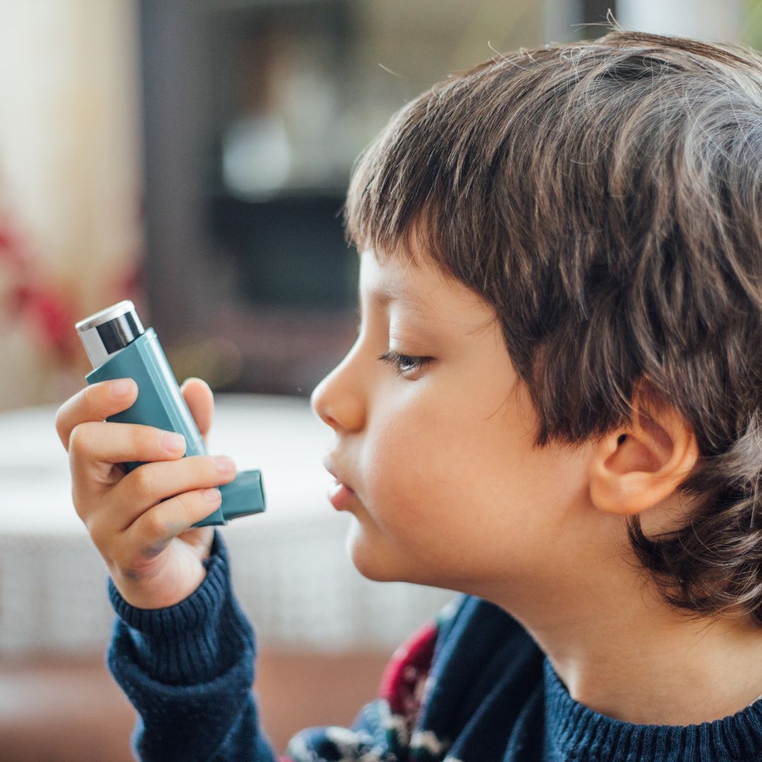 boy using inhaler